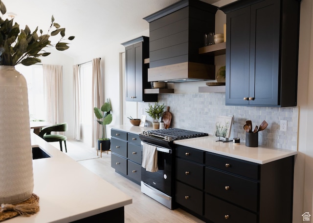 908 E 430 N Unit 18, Salem, UT 84653 - kitchen featuring decorative backsplash, custom exhaust hood, and stainless steel gas range oven