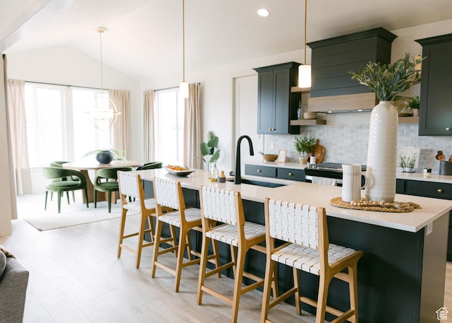 908 E 430 N Unit 18, Salem, UT 84653 - kitchen featuring sink, pendant lighting, a kitchen bar, and an island with sink