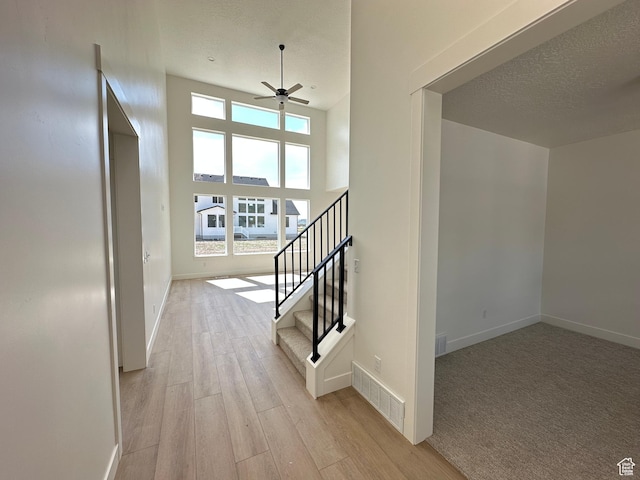 325 N 1040 E Unit 26, Salem, UT 84653 - hallway featuring light wood-style flooring, baseboards, and stairway