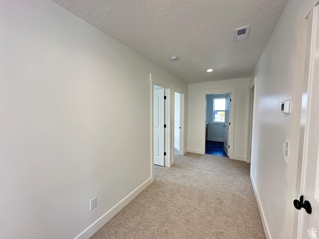 325 N 1040 E Unit 26, Salem, UT 84653 - hallway with baseboards, a textured ceiling, light carpet, and recessed lighting