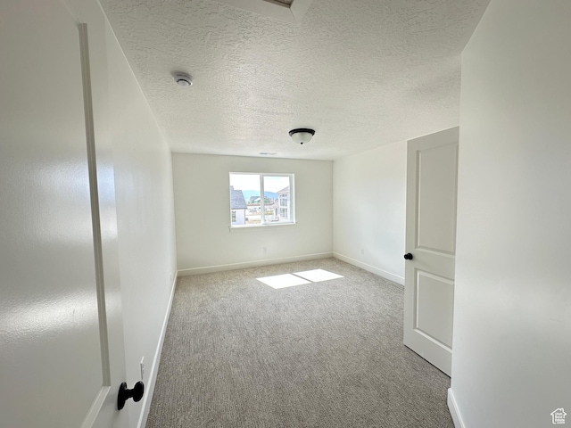 325 N 1040 E Unit 26, Salem, UT 84653 - unfurnished room featuring carpet, baseboards, and a textured ceiling