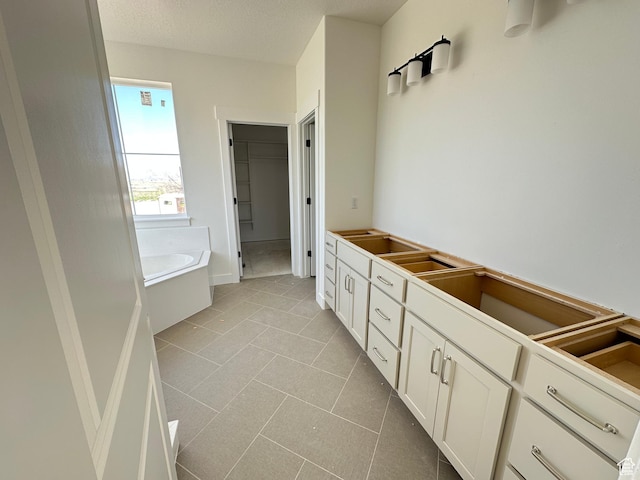 1412 N 290 E Unit 5, Salem, UT 84653 - full bath featuring a garden tub, a spacious closet, tile patterned flooring, and a textured ceiling