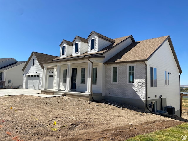 246 S 2800 E Unit 110, Spanish Fork, UT 84660 - view of front facade featuring a porch, cooling unit, and a garage