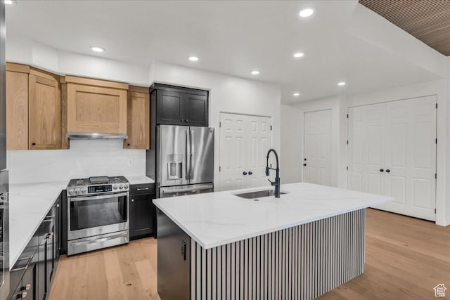 2255 N Tuweap Dr Unit 45, St George, UT 84770 - kitchen with light wood-style flooring, light stone countertops, stainless steel appliances, a sink, and recessed lighting