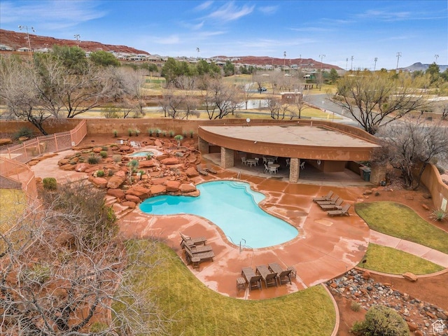 2255 N Tuweap Dr Unit 45, St George, UT 84770 - community pool with a fenced backyard, a patio, and a lawn