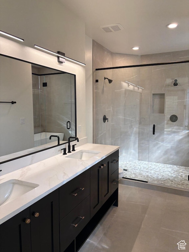 2255 N Tuweap Dr Unit 45, St George, UT 84770 - full bathroom with a stall shower, visible vents, a sink, and double vanity