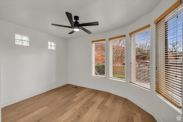 2255 N Tuweap Dr Unit 45, St George, UT 84770 - empty room with light wood-style floors, a healthy amount of sunlight, ceiling fan, and baseboards