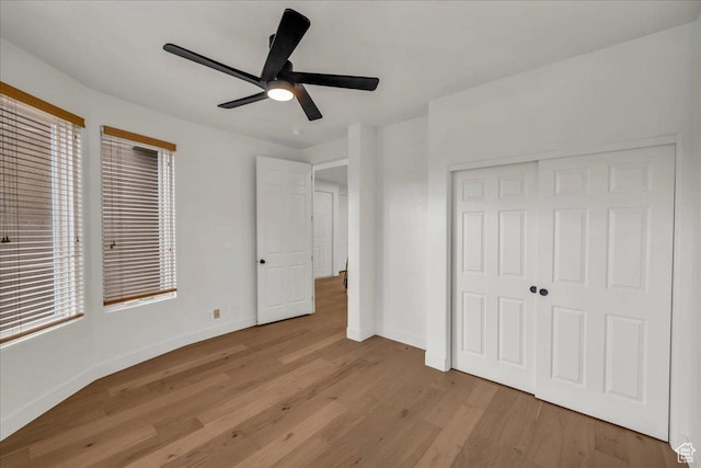 2255 N Tuweap Dr Unit 45, St George, UT 84770 - unfurnished bedroom with a ceiling fan, a closet, baseboards, and wood finished floors