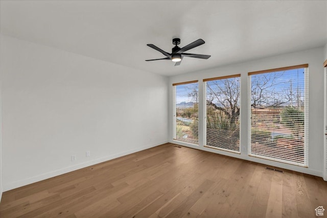 2255 N Tuweap Dr Unit 45, St George, UT 84770 - spare room featuring a ceiling fan, visible vents, baseboards, and wood finished floors