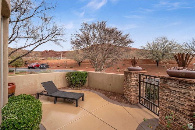 2255 N Tuweap Dr Unit 45, St George, UT 84770 - view of patio with a gate and fence