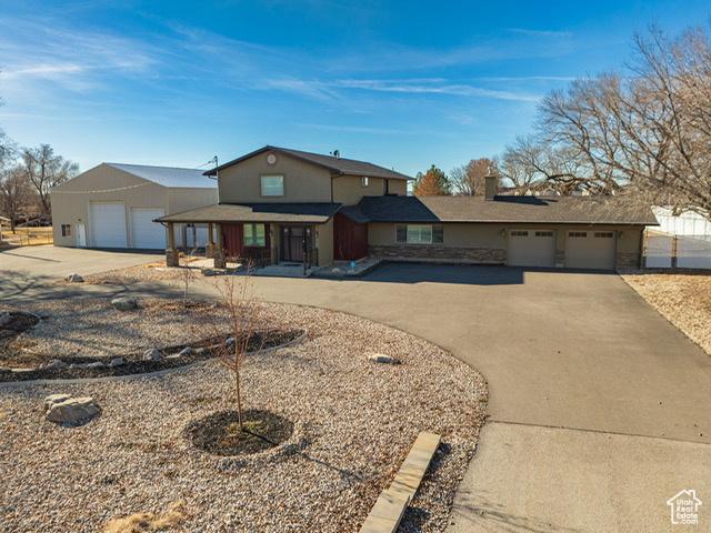 969 N 1200 W, Marriott Slaterville, UT 84404 - view of front of home with a garage