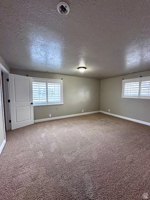 969 N 1200 W, Marriott Slaterville, UT 84404 - carpeted spare room with a textured ceiling and a healthy amount of sunlight