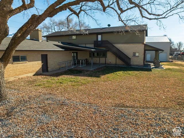 969 N 1200 W, Marriott Slaterville, UT 84404 - back of house with a lawn and a patio area