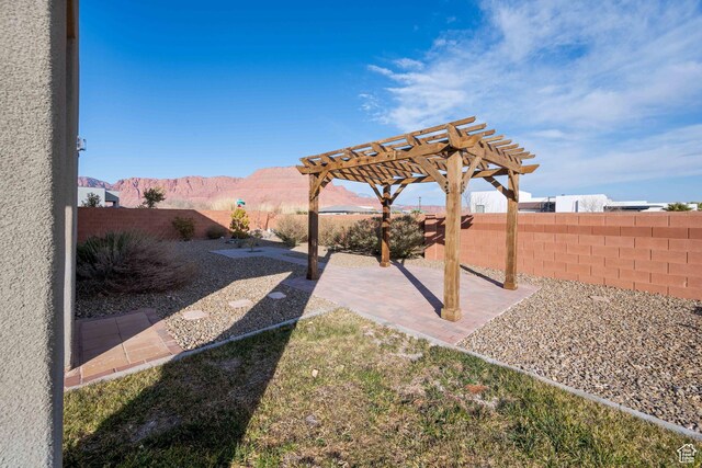 617 W 280 S, Ivins, UT 84738 - view of yard with a mountain view, a pergola, and a patio area