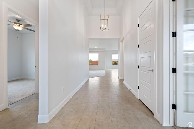 617 W 280 S, Ivins, UT 84738 - hallway with light tile patterned floors, a chandelier, and a high ceiling