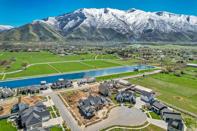 aerial view featuring a residential view and a water and mountain view