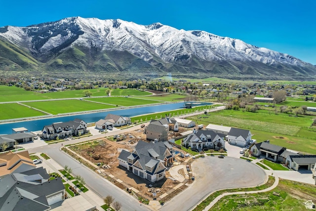 bird's eye view featuring a water and mountain view and a residential view