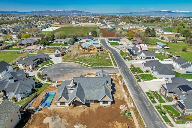aerial view with a mountain view and a residential view