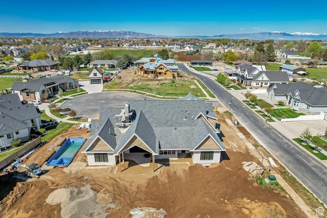 birds eye view of property with a residential view and a mountain view