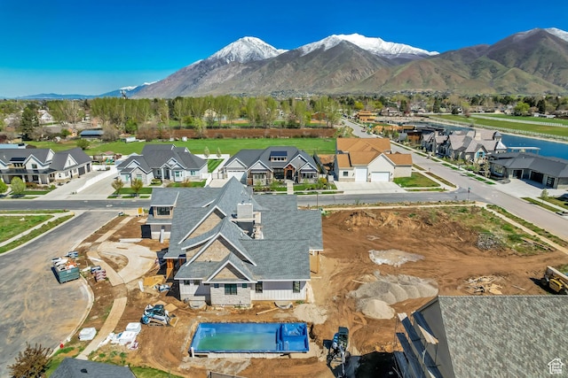 drone / aerial view featuring a residential view and a mountain view