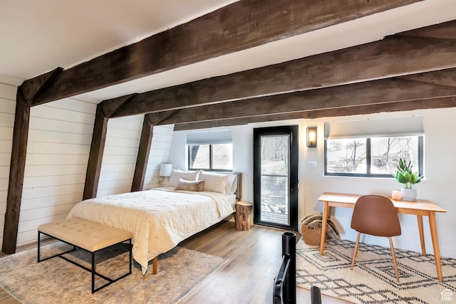 10481 E Spring Creek Dr Unit 722, Heber City, UT 84032 - bedroom with light wood-type flooring, beamed ceiling, access to outside, and wood walls