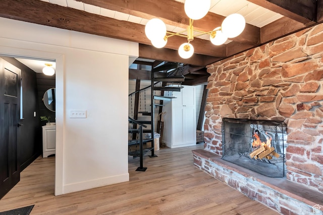 10481 E Spring Creek Dr Unit 722, Heber City, UT 84032 - living room featuring light hardwood / wood-style flooring, beamed ceiling, and a fireplace