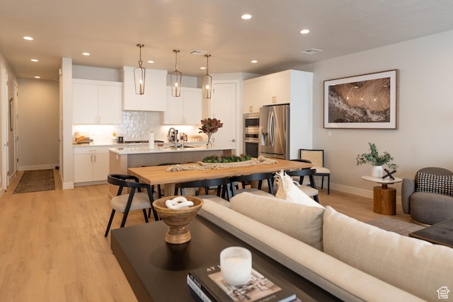 5398 S Aquamarine Ln, St George, UT 84790 - living room featuring sink and light hardwood / wood-style flooring