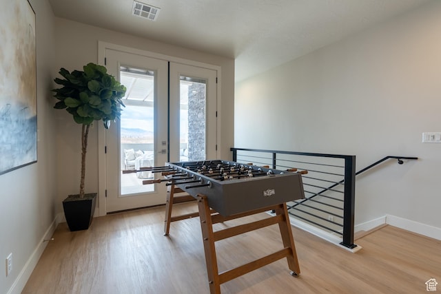 5398 S Aquamarine Ln, St George, UT 84790 - recreation room featuring light wood-type flooring and french doors