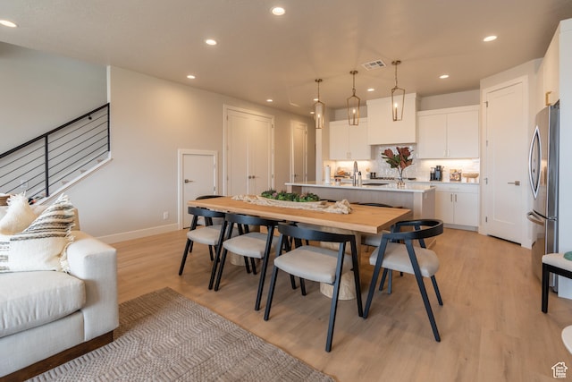 5398 S Aquamarine Ln, St George, UT 84790 - dining space with sink and light hardwood / wood-style floors