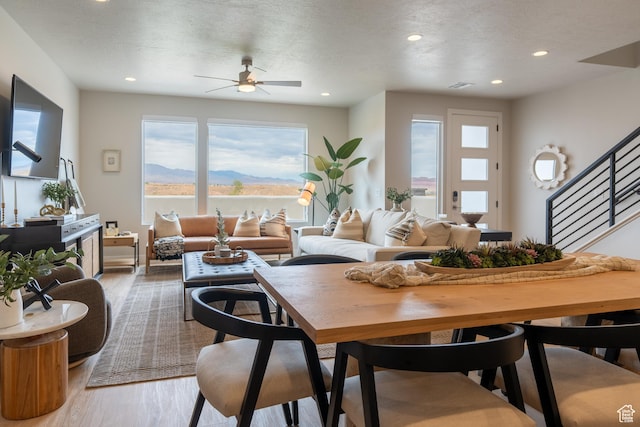 5398 S Aquamarine Ln, St George, UT 84790 - living room featuring a mountain view, a textured ceiling, ceiling fan, and wood-type flooring
