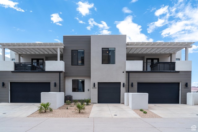 5398 S Aquamarine Ln, St George, UT 84790 - modern home with central AC unit, a garage, and a balcony