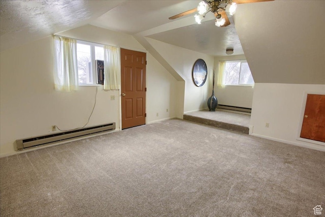 bonus room with carpet, a baseboard heating unit, and lofted ceiling