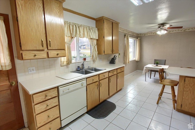 kitchen with white dishwasher, tasteful backsplash, ceiling fan, light tile patterned floors, and sink