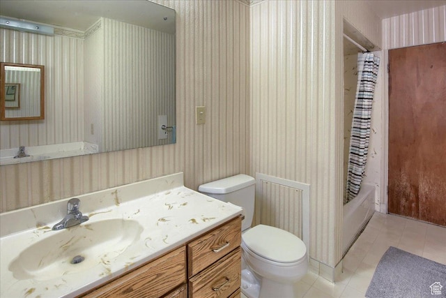 full bathroom featuring tile patterned floors, toilet, vanity, and shower / bath combination with curtain