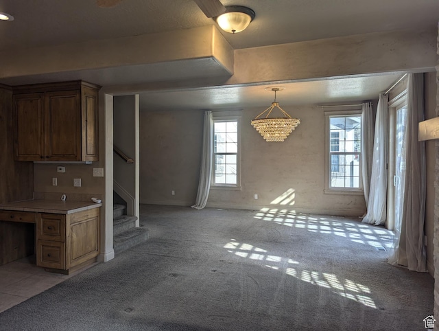 3006 E Somerset Dr, Spanish Fork, UT 84660 - interior space with an inviting chandelier, light carpet, and stairs
