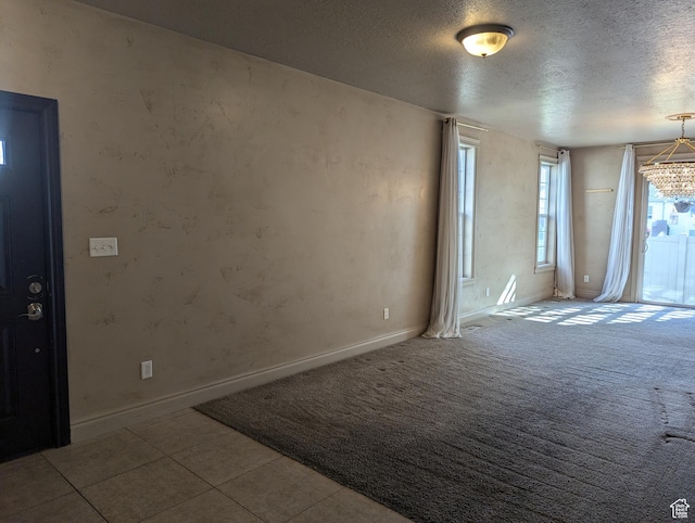 3006 E Somerset Dr, Spanish Fork, UT 84660 - carpeted spare room featuring a textured ceiling and baseboards