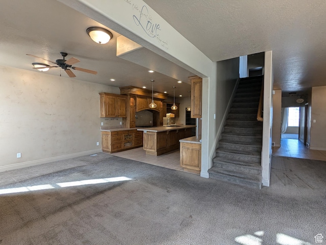 3006 E Somerset Dr, Spanish Fork, UT 84660 - unfurnished living room with ceiling fan, a textured ceiling, light carpet, and stairs