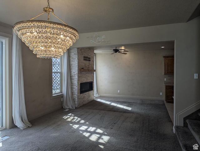 3006 E Somerset Dr, Spanish Fork, UT 84660 - unfurnished living room featuring baseboards, carpet, a fireplace, stairway, and ceiling fan with notable chandelier