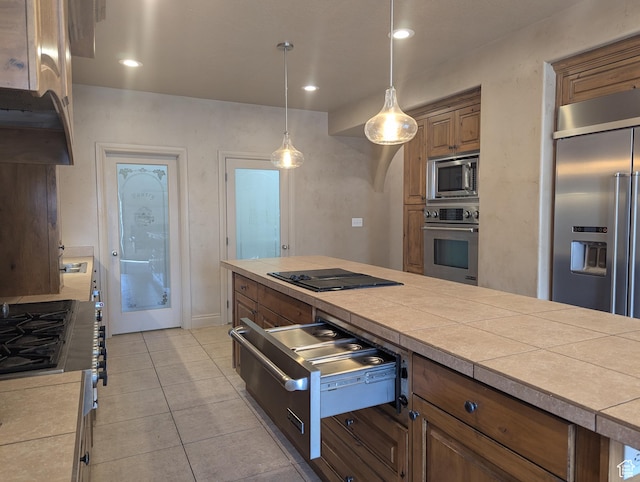 3006 E Somerset Dr, Spanish Fork, UT 84660 - kitchen with built in appliances, recessed lighting, a warming drawer, brown cabinetry, and hanging light fixtures