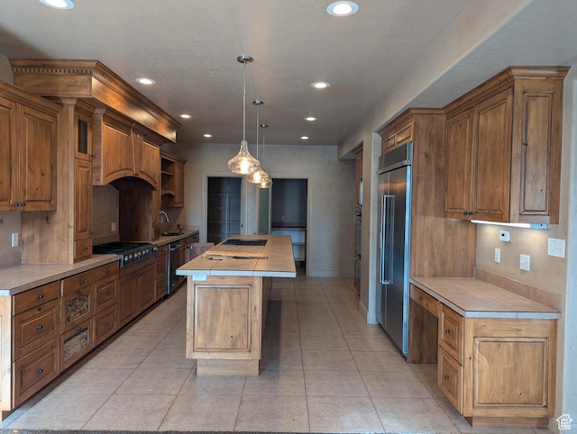 3006 E Somerset Dr, Spanish Fork, UT 84660 - kitchen featuring light tile patterned floors, a kitchen island, stainless steel appliances, beverage cooler, and a sink