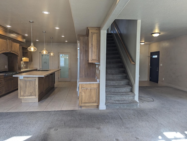 3006 E Somerset Dr, Spanish Fork, UT 84660 - kitchen with light countertops, a kitchen island, light tile patterned flooring, and light carpet