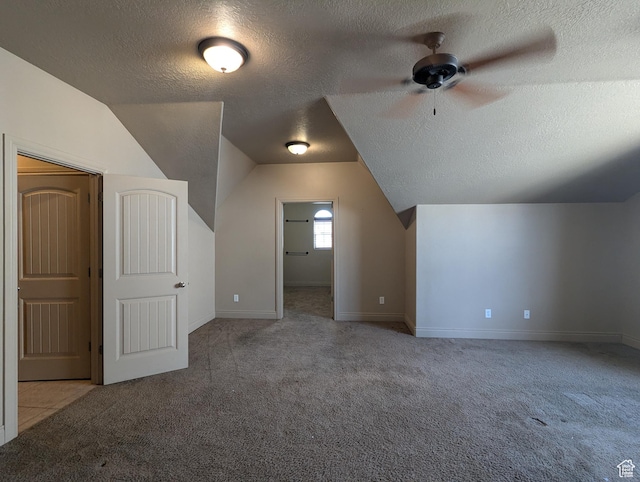 3006 E Somerset Dr, Spanish Fork, UT 84660 - bonus room featuring baseboards, a ceiling fan, a textured ceiling, carpet flooring, and lofted ceiling