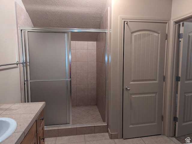 3006 E Somerset Dr, Spanish Fork, UT 84660 - bathroom featuring a shower stall, tile patterned floors, and vanity