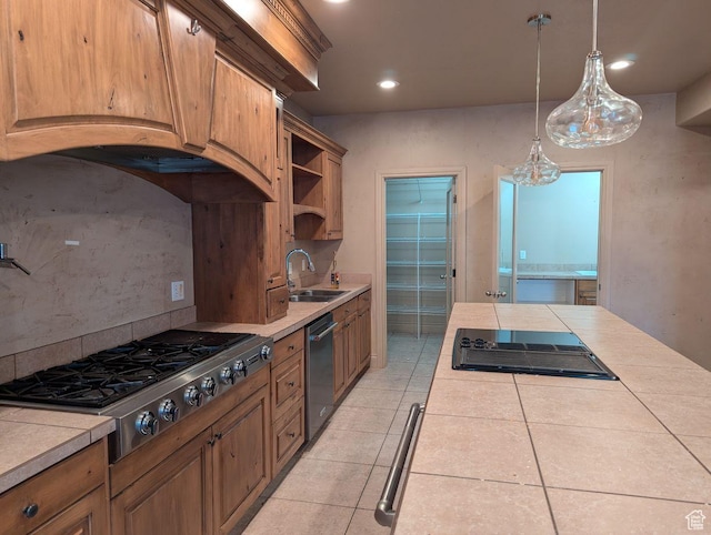3006 E Somerset Dr, Spanish Fork, UT 84660 - kitchen featuring tasteful backsplash, tile counters, light tile patterned floors, stainless steel appliances, and a sink
