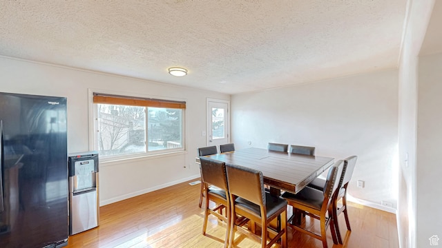 1125 N Trinnaman Ln, Lehi, UT 84043 - dining area featuring a textured ceiling and light hardwood / wood-style flooring