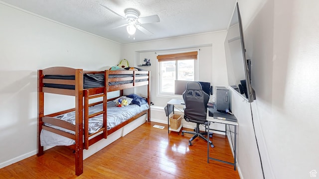 1125 N Trinnaman Ln, Lehi, UT 84043 - bedroom with hardwood / wood-style flooring, ceiling fan, and a textured ceiling