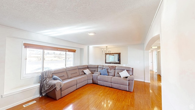 1125 N Trinnaman Ln, Lehi, UT 84043 - living room featuring wood-type flooring and a textured ceiling
