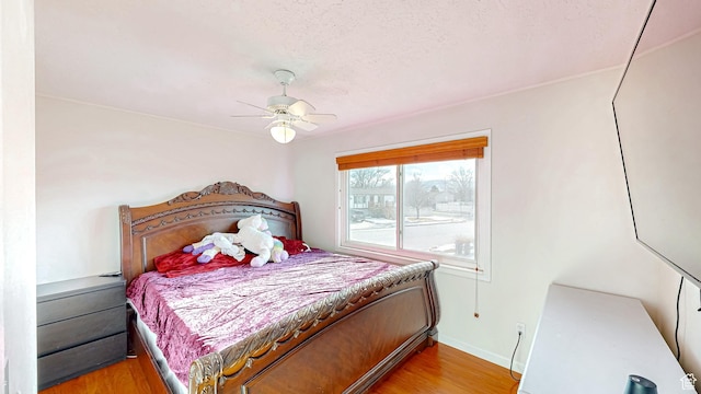 1125 N Trinnaman Ln, Lehi, UT 84043 - bedroom featuring hardwood / wood-style flooring, ceiling fan, and a textured ceiling