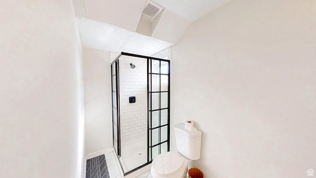 1125 N Trinnaman Ln, Lehi, UT 84043 - bathroom featuring tile patterned floors, toilet, and an enclosed shower