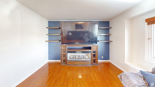 1125 N Trinnaman Ln, Lehi, UT 84043 - unfurnished living room featuring hardwood / wood-style flooring and ornamental molding